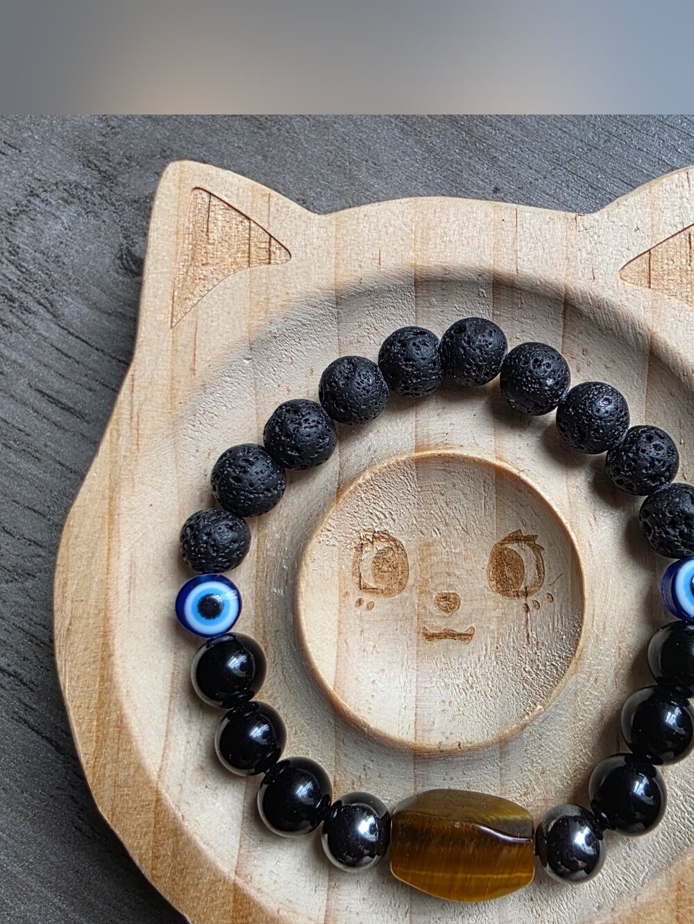 Lava Stone and Black Obsidian Bead Stretch Bracelet with Blue Evil Eye Accent.